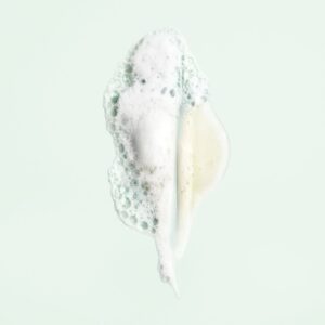 shampoing cheveux bouclés Oribe , shampoing hydratant boucles, shampoing sans sulfate boucles, nettoyage doux boucles, anti-frizz cheveux bouclés